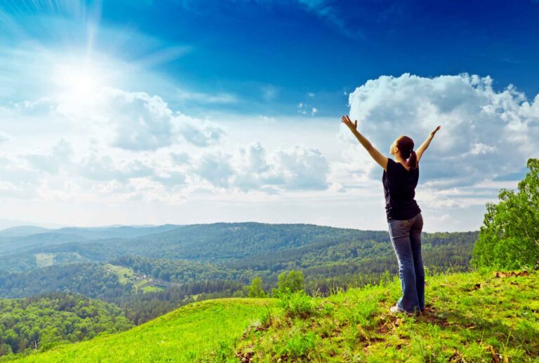 Lady hands up to the sky
